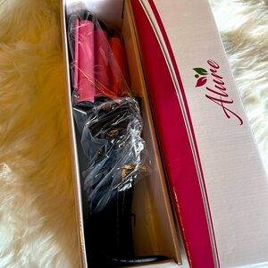 Allure 3 barrel curling iron . New in box